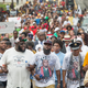 hael Brown Sr. (C-front) leads a march from the location where his son Michael Brown Jr. was shot and killed following a memorial service marking the anniversary of his death on August 9, 2015 in Ferguson, Missouri.